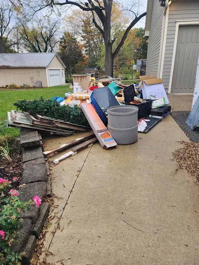 Dumpster being loaded with debris for Estate Cleanout Dumpster Rental in Eastlake